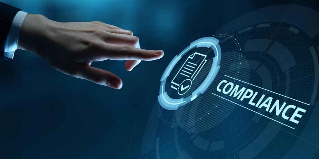 A person's hand points towards a glowing digital ring with a "COMPLIANCE" icon and a checklist document. This image represents the concept of business compliance and regulatory adherence, particularly relevant for PDPA Compliance Malaysia.